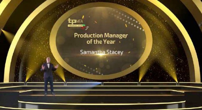 A virtual awards stage in gold, the host presenting Production Manager of the Year